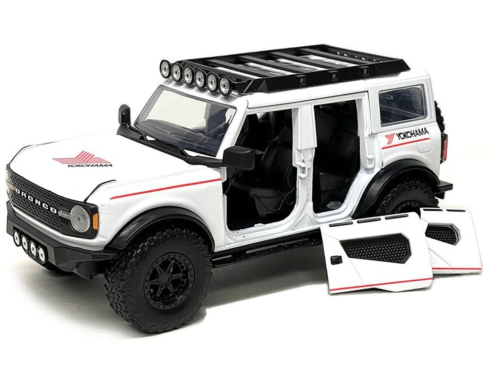 2021 Ford Bronco White with Red Stripes and Roof Rack "Yokohama Tires" "Just Trucks" Series 1/24 Diecast Model Car by Jada view 2