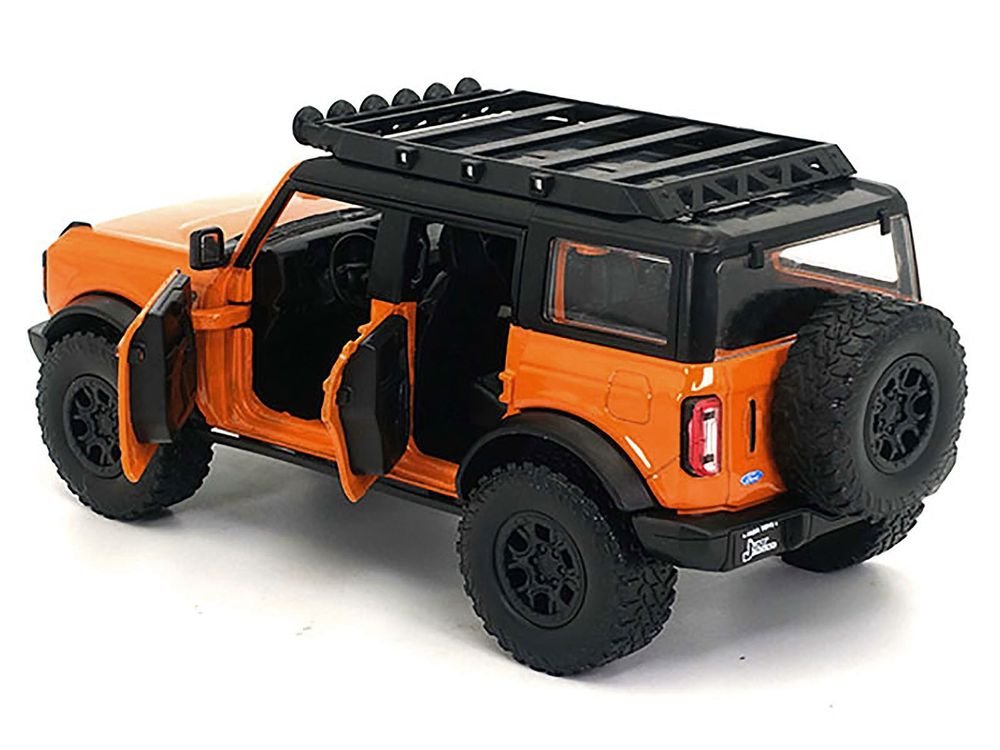 2021 Ford Bronco Orange with Black Stripes and Roof Rack "Just Trucks" Series 1/24 Diecast Model Car by Jada view 2