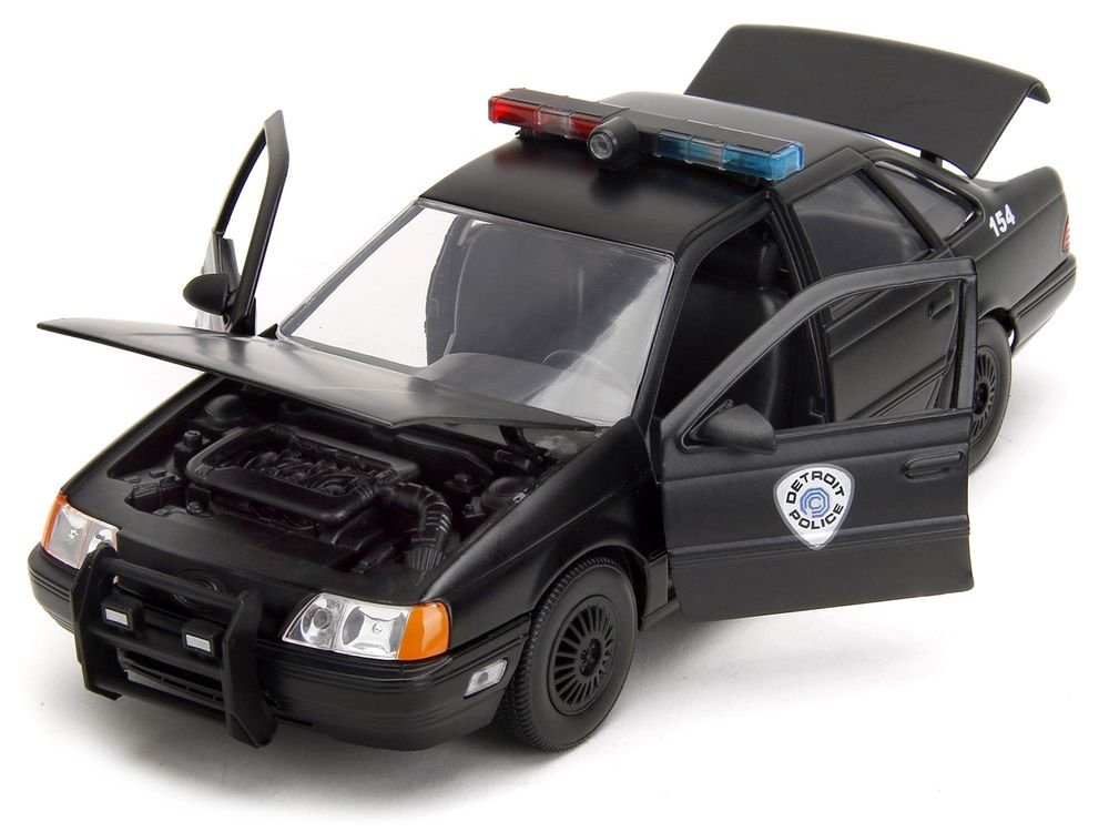 Ford Taurus OCP Matt Black "Detroit Police" and Robocop Diecast Figure 35th Anniversary "Robocop" (1987) Movie "Hollywood Rides" Series 1/24 Diecast Model Car by Jada view 2