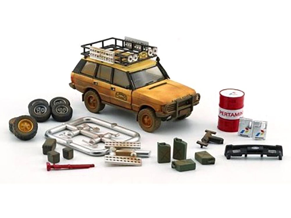Land Rover Range Rover Classic LSE RHD (Right Hand Drive) "Camel Trophy" Yellow (Dirty Mud Version) with Roof Rack Extra Wheels and Accessories Limited Edition to 2016 pieces Worldwide 1/64 Diecast Model Car by BM Creations view 2