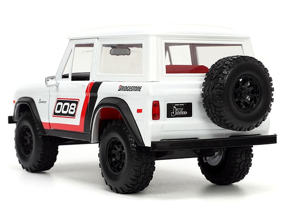 1973 Ford Bronco #008 White with Red and Black Stripes and Red Interior with Extra Wheels "Just Trucks" Series 1/24 Diecast Model Car by Jada view 5