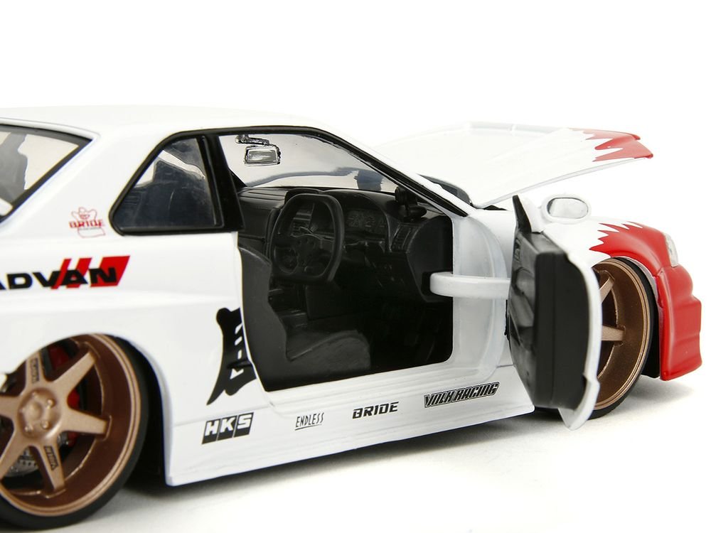 2002 Nissan Skyline GT-R (R34) RHD (Right Hand Drive) White with Red Graphics and Ryu Diecast Figure "Street Fighter" Video Game "Anime Hollywood Rides" Series 1/24 Diecast Model Car by Jada view 3