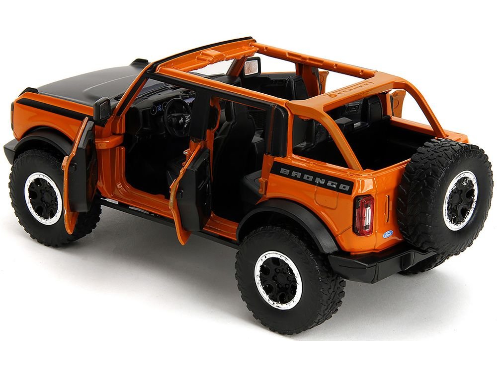2021 Ford Bronco Open-Top Orange with Black Stripes and Hood with Extra Wheels "Just Trucks" Series 1/24 Diecast Model Car by Jada view 4