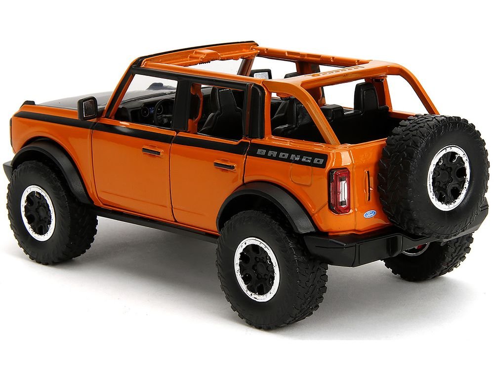 2021 Ford Bronco Open-Top Orange with Black Stripes and Hood with Extra Wheels "Just Trucks" Series 1/24 Diecast Model Car by Jada view 5
