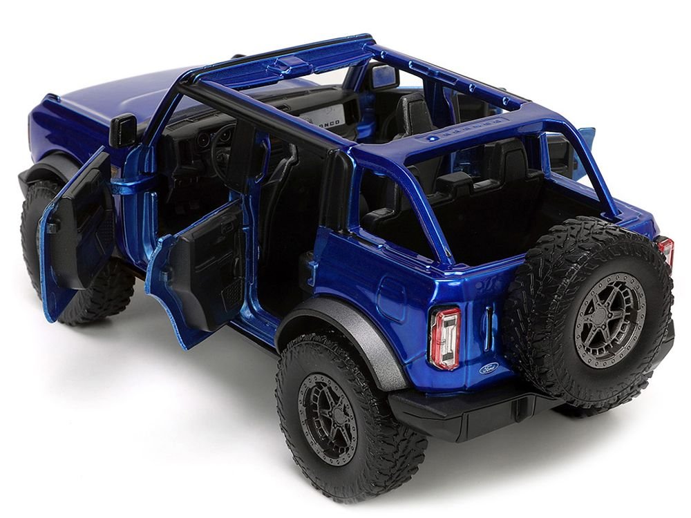 2021 Ford Bronco Open-Top Candy Blue Metallic with Extra Wheels "Just Trucks" Series 1/24 Diecast Model Car by Jada view 4