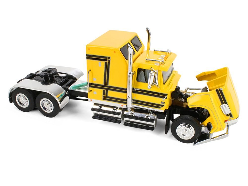 Ford LTL 9000 with 60" Aerodyne Sleeper and 53' Wilson Roadbrute Flatbed Trailer with Covered Wagon Yellow with Black Stripes 1/64 Diecast Model by DCP/First Gear view 2