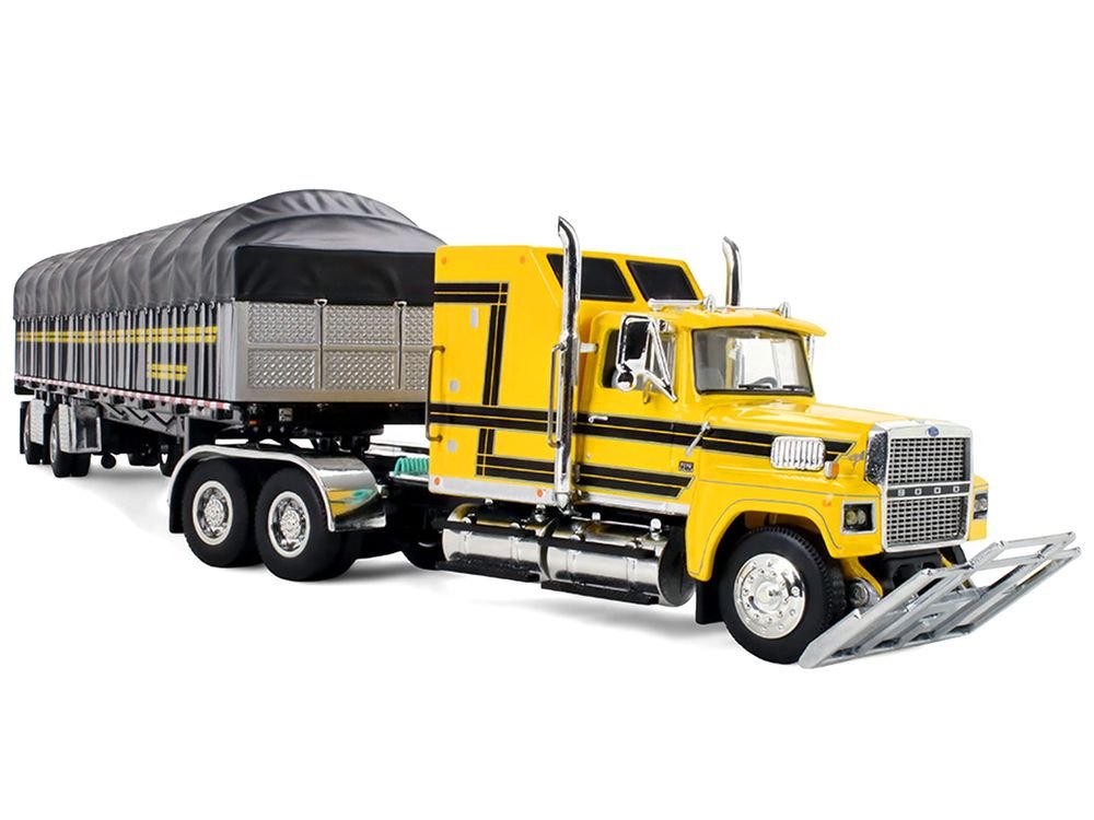 Ford LTL 9000 with 60" Aerodyne Sleeper and 53' Wilson Roadbrute Flatbed Trailer with Covered Wagon Yellow with Black Stripes 1/64 Diecast Model by DCP/First Gear view 5